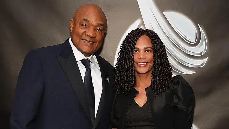 Mary Joan Martelly and George Foreman